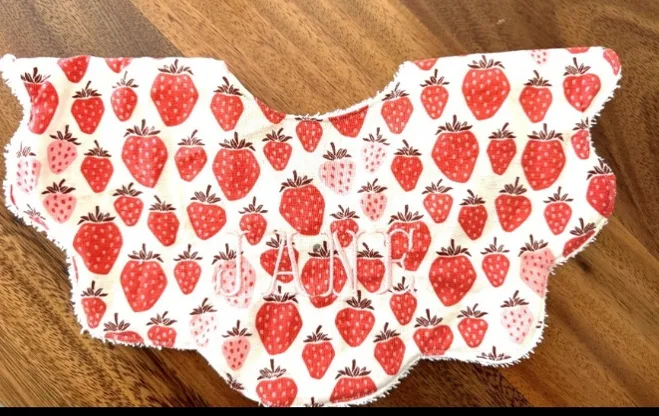Recalled bib with strawberry print